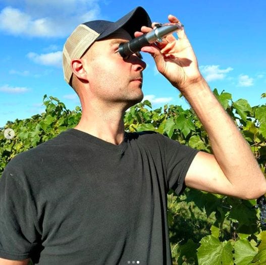 Russell uses a refractometer, used to measure Brix, or the amount of sugar in the juice from a grape