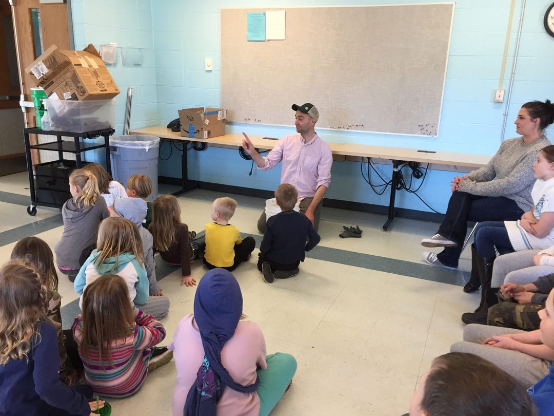 Russell Rolffs teaches a lesson in front of Island School students in a classroom