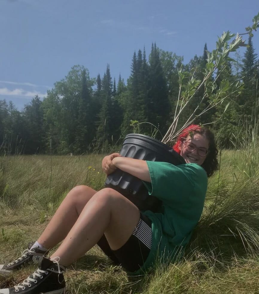 Intern planting trees